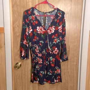 Brand new with tags, never worn, blue floral romper